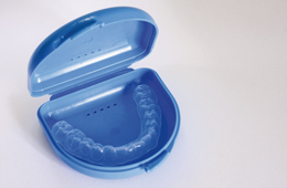 clear-dental-aligner-in-blue-case